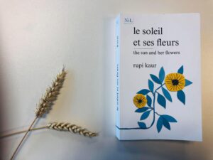 Photograph of Rupi Kaur Book on table with wheat